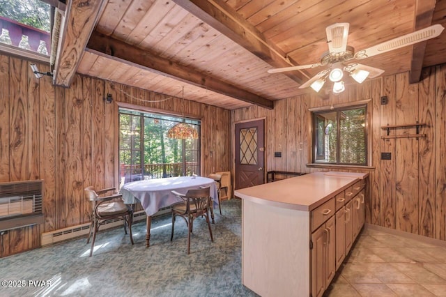 77 Brookfield Rd, Lake Ariel, PA 18436 - kitchen featuring a wood ceiling with exposed beams, wooden walls, light countertops, ceiling fan, and a peninsula