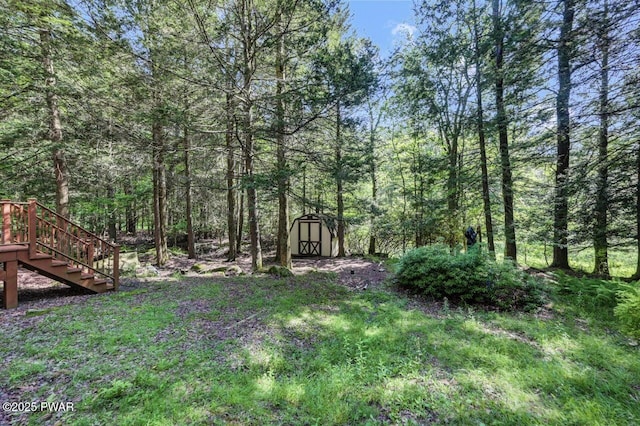 77 Brookfield Rd, Lake Ariel, PA 18436 - view of yard with a storage shed, stairway, and a wooded view