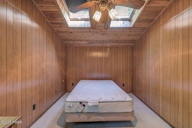 77 Brookfield Rd, Lake Ariel, PA 18436 - bedroom featuring a skylight, light colored carpet, and wooden walls