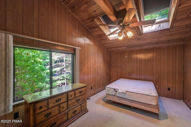 77 Brookfield Rd, Lake Ariel, PA 18436 - bedroom with a skylight, wooden walls, lofted ceiling, wooden ceiling, and light carpet