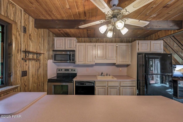77 Brookfield Rd, Lake Ariel, PA 18436 - kitchen featuring black appliances, a wood ceiling with exposed beams, wooden walls, light countertops, and ceiling fan