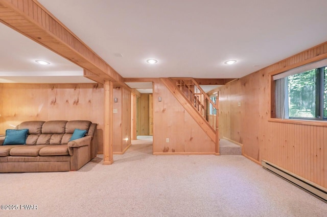 77 Brookfield Rd, Lake Ariel, PA 18436 - unfurnished living room featuring a baseboard radiator, wooden walls, stairs, carpet flooring, and recessed lighting