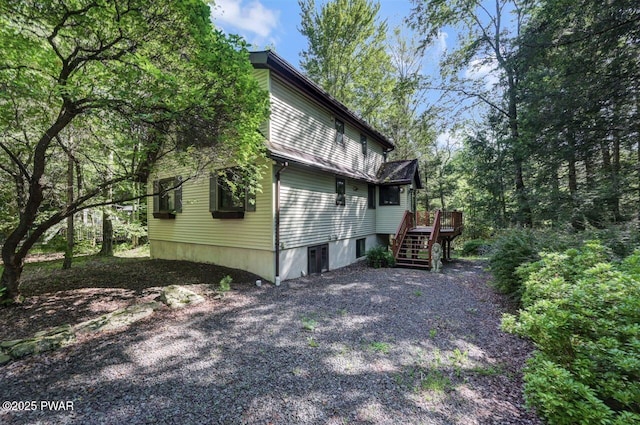 77 Brookfield Rd, Lake Ariel, PA 18436 - view of side of home with stairway and a wooden deck