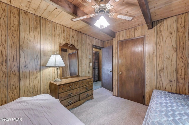 77 Brookfield Rd, Lake Ariel, PA 18436 - carpeted bedroom featuring a wooden ceiling with exposed beams, wooden walls, and a ceiling fan