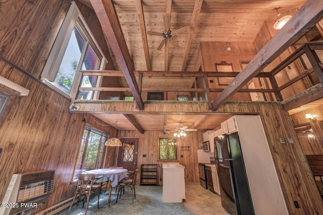 77 Brookfield Rd, Lake Ariel, PA 18436 - kitchen with wood walls, freestanding refrigerator, a wood ceiling with exposed beams, ceiling fan, and plenty of natural light