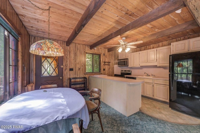 77 Brookfield Rd, Lake Ariel, PA 18436 - kitchen with stainless steel appliances, a wood ceiling with exposed beams, light countertops, wood walls, and a kitchen island