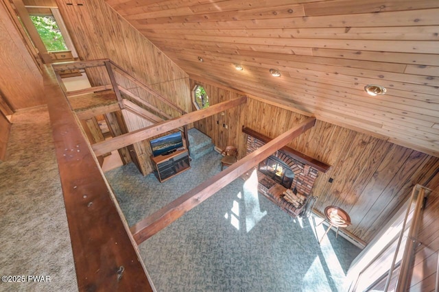 77 Brookfield Rd, Lake Ariel, PA 18436 - unfurnished living room with wooden walls, lofted ceiling, wood ceiling, and carpet