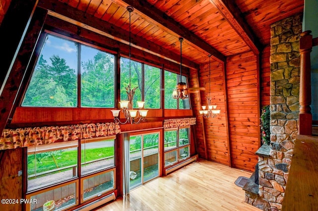 interior space featuring wood ceiling, hardwood / wood-style flooring, a baseboard radiator, a notable chandelier, and beamed ceiling