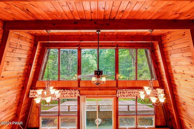 room details with beamed ceiling and a notable chandelier