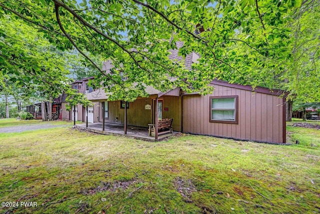 exterior space with a patio and a front lawn