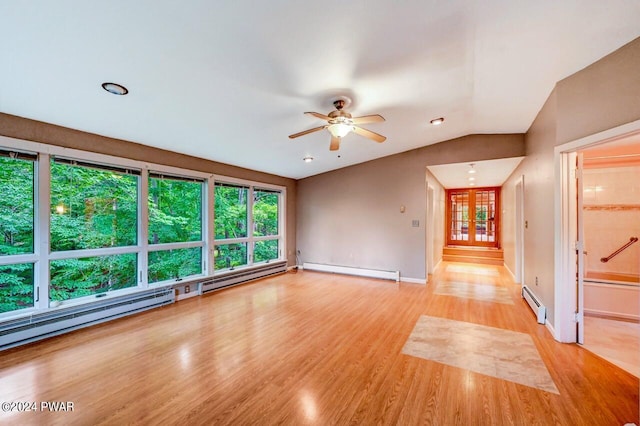 unfurnished living room featuring ceiling fan, vaulted ceiling, light wood-type flooring, and a baseboard radiator