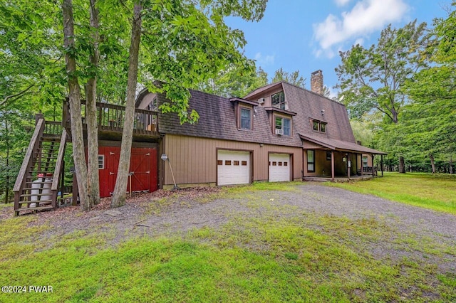 view of front of home featuring a garage and a front yard