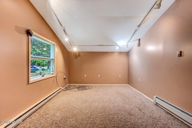 additional living space featuring carpet flooring, lofted ceiling, and a baseboard heating unit