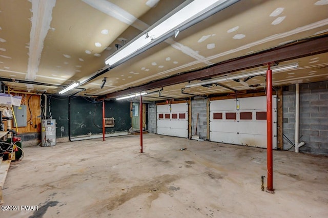 garage featuring gas water heater and electric panel