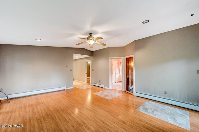 empty room featuring ceiling fan, a baseboard radiator, and light hardwood / wood-style floors