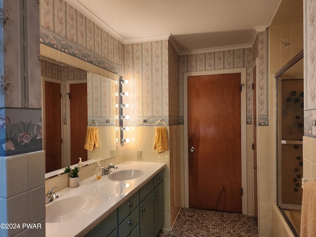 bathroom with enclosed tub / shower combo, tile patterned floors, crown molding, vanity, and tile walls