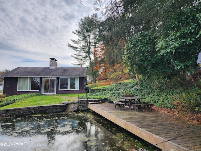 exterior space with a lawn and a wooden deck