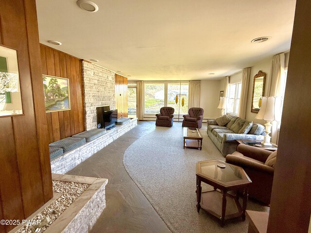 dining area with baseboard heating, a wealth of natural light, and an inviting chandelier