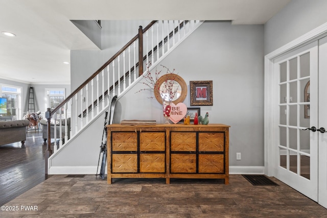 stairway featuring french doors and hardwood / wood-style floors