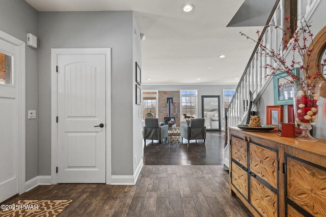 entryway with dark wood-type flooring