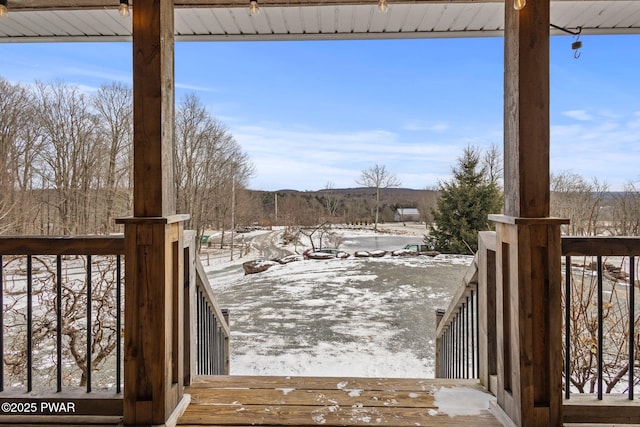 view of snow covered deck