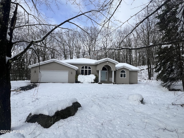 single story home featuring a garage