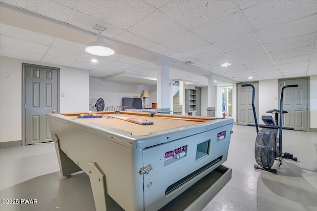 recreation room featuring a paneled ceiling, finished concrete floors, and billiards