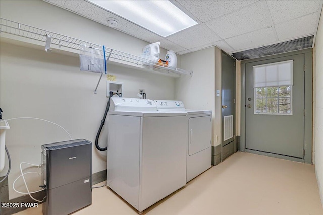 laundry room featuring laundry area, visible vents, and washer and clothes dryer