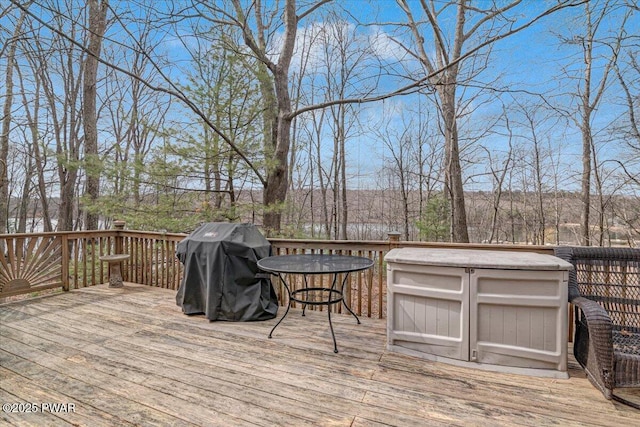 wooden terrace with area for grilling