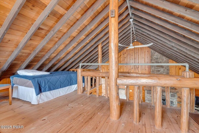 unfurnished bedroom featuring wood ceiling, vaulted ceiling with beams, and hardwood / wood-style flooring