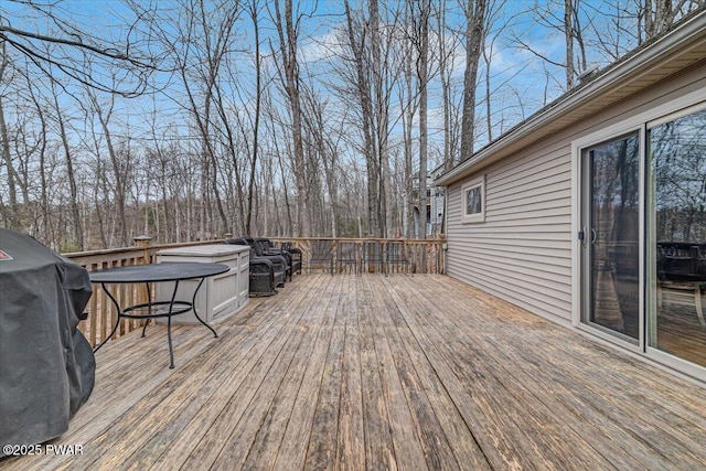 wooden deck with grilling area