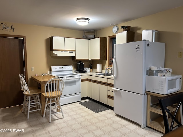 1024 Pitt Rd, Newfoundland, PA 18445 - kitchen featuring white appliances, under cabinet range hood, light flooring, light countertops, and white cabinetry
