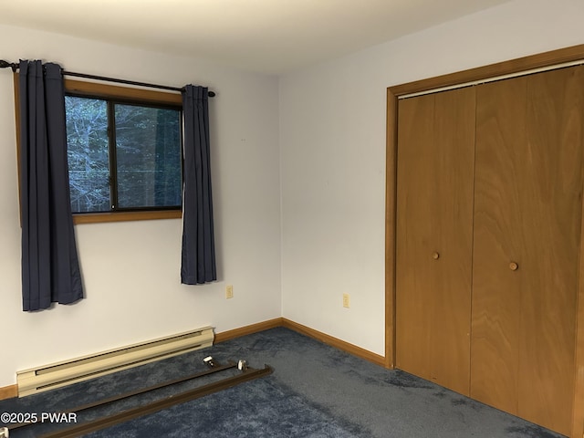1024 Pitt Rd, Newfoundland, PA 18445 - unfurnished bedroom featuring a baseboard radiator, carpet flooring, and a closet