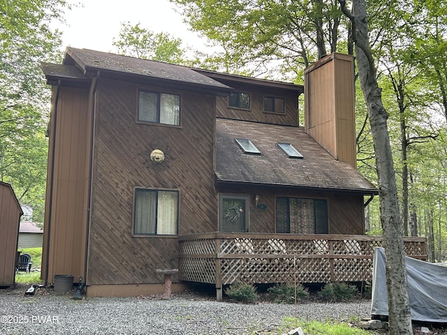 1024 Pitt Rd, Newfoundland, PA 18445 - back of property with a chimney and a shingled roof