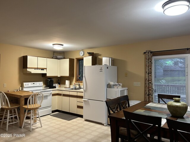 1024 Pitt Rd, Newfoundland, PA 18445 - kitchen with white appliances, under cabinet range hood, light countertops, light flooring, and white cabinets