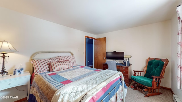 bedroom featuring a baseboard radiator and carpet floors