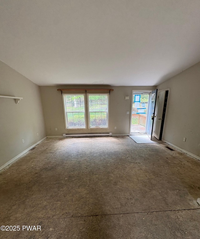 unfurnished room featuring a baseboard heating unit, carpet flooring, and baseboards