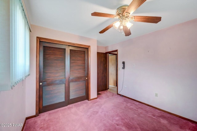 1528 Mount Cobb Rd, Jefferson Township, PA 18436 - unfurnished bedroom featuring a closet, carpet floors, and a ceiling fan