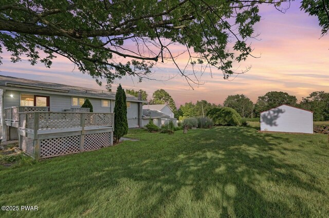 1528 Mount Cobb Rd, Jefferson Township, PA 18436 - view of green lawn featuring a wooden deck and a storage shed