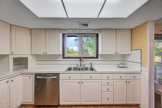 1528 Mount Cobb Rd, Jefferson Township, PA 18436 - kitchen with dishwasher, light countertops, backsplash, and white cabinets