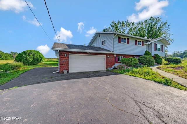 1528 Mount Cobb Rd, Jefferson Township, PA 18436 - view of front of house featuring brick siding, a garage, and asphalt driveway