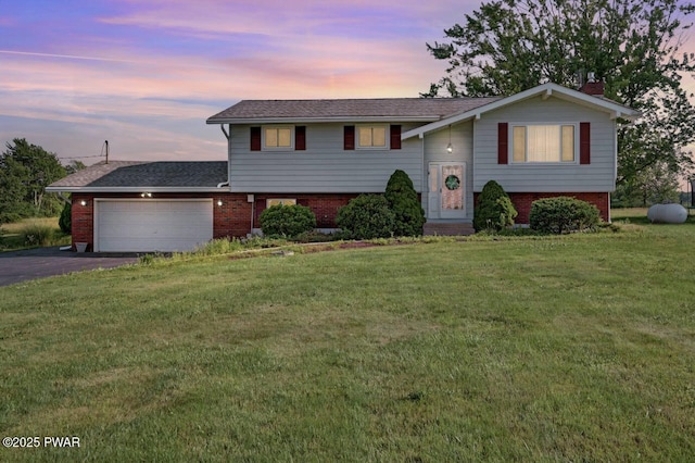 1528 Mount Cobb Rd, Jefferson Township, PA 18436 - bi-level home with brick siding, a garage, a yard, asphalt driveway, and a chimney