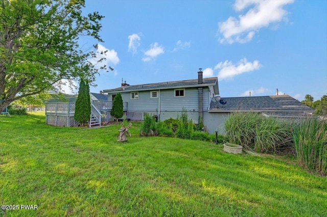 1528 Mount Cobb Rd, Jefferson Township, PA 18436 - rear view of house featuring a chimney and a lawn