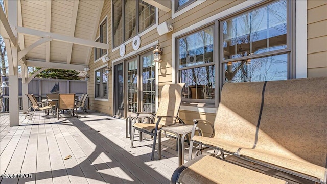 deck with outdoor dining area