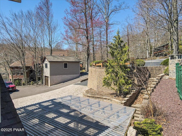 view of patio / terrace featuring an outbuilding