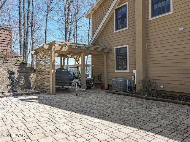 view of patio featuring a pergola and cooling unit