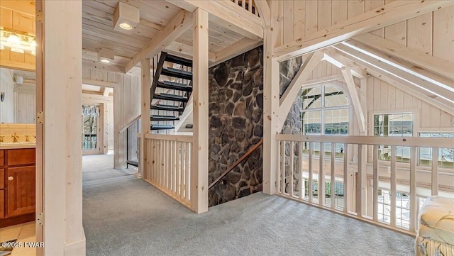 bonus room featuring wood ceiling, lofted ceiling, a sink, and carpet