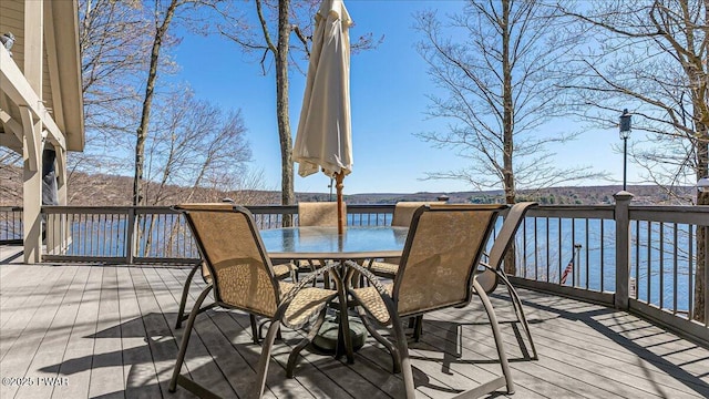 deck featuring outdoor dining area