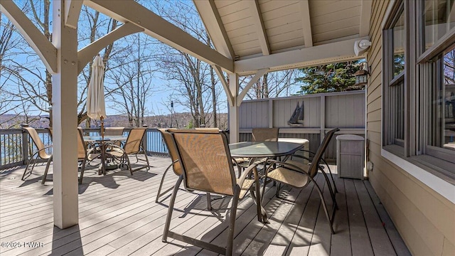 wooden terrace with outdoor dining area