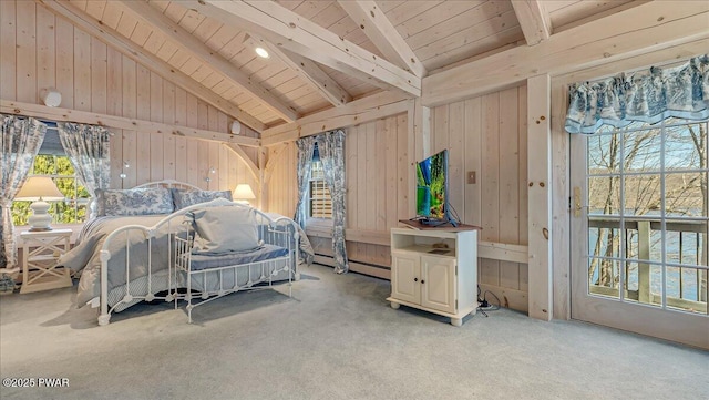 bedroom with lofted ceiling with beams, multiple windows, and wood ceiling
